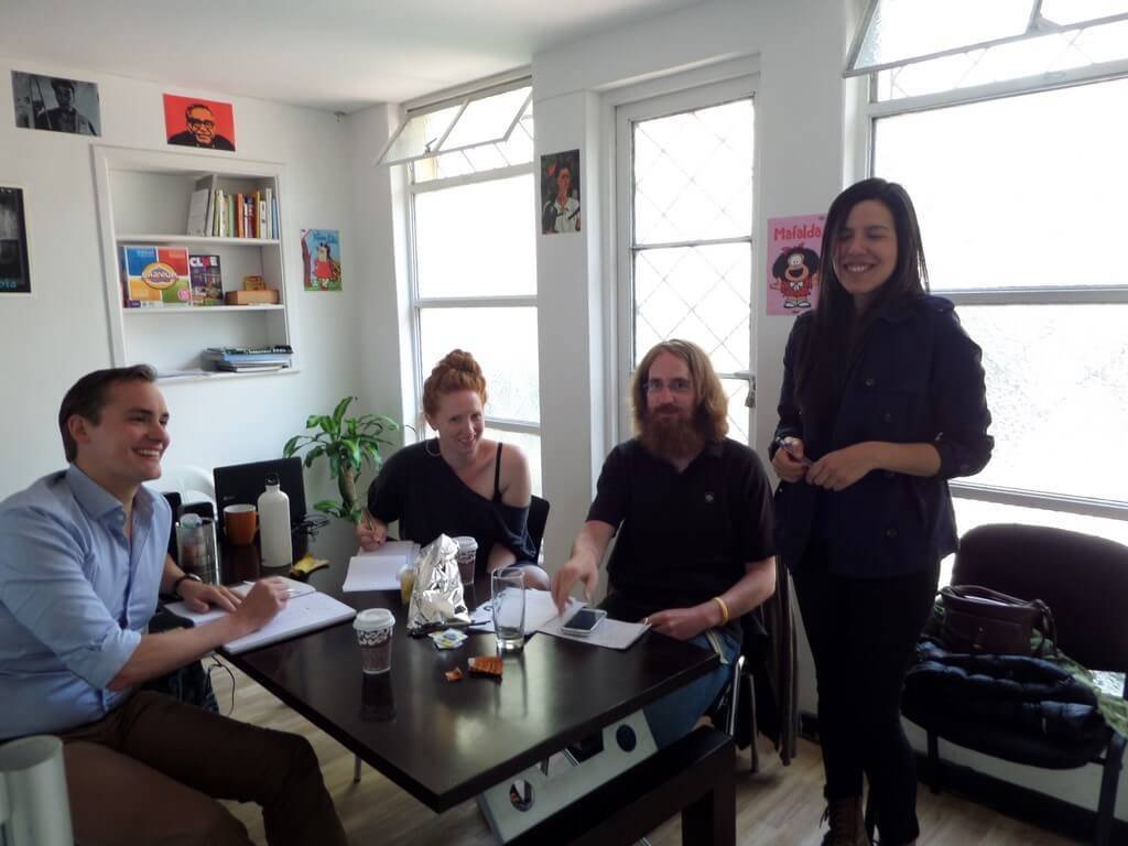 Three students looking at the camera. Contact us