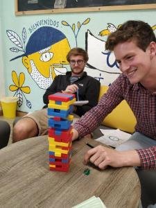 Student is playing jenga at Whee institute Spanish School in Bogota Colombia